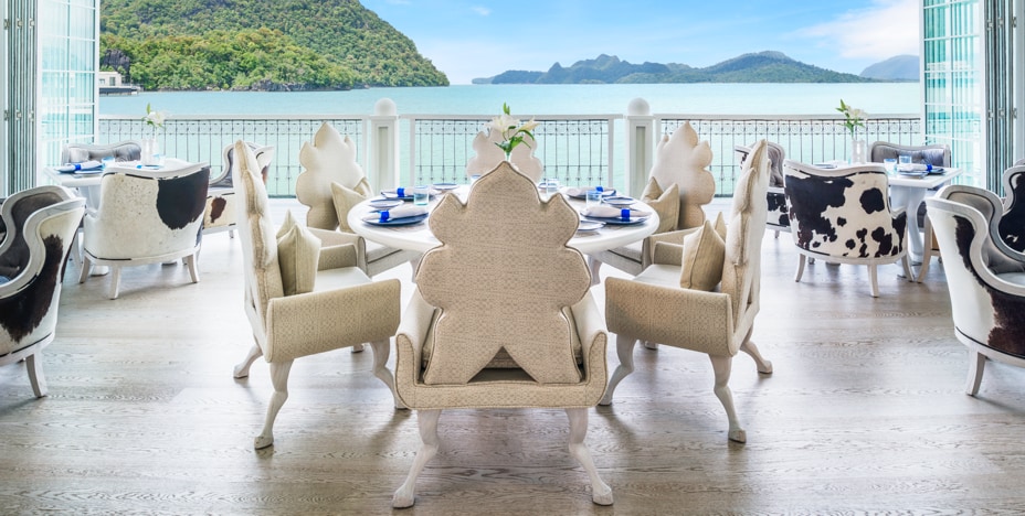 Lavish hotel dining hall facing a lake
