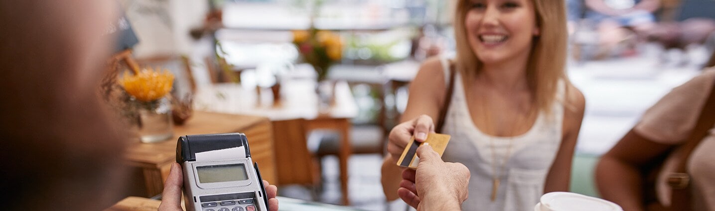 woman-making-a-purchase-using-her-credit-card woman-making-a-purchase-using-her-credit-card